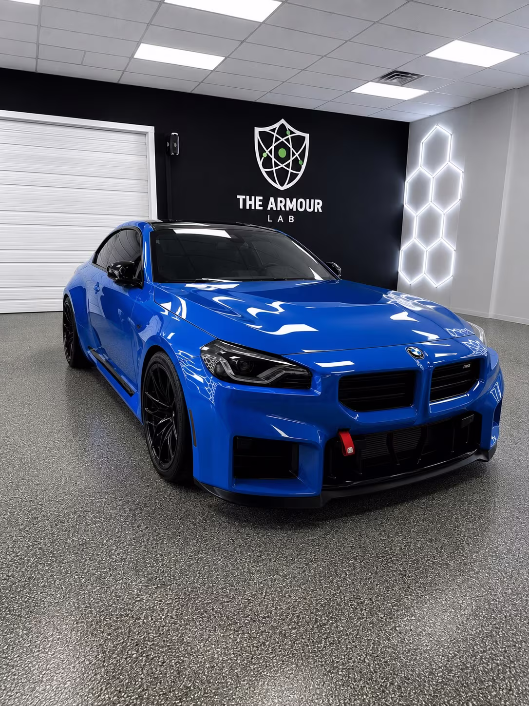 BMW M2 under the Armour Lab wall