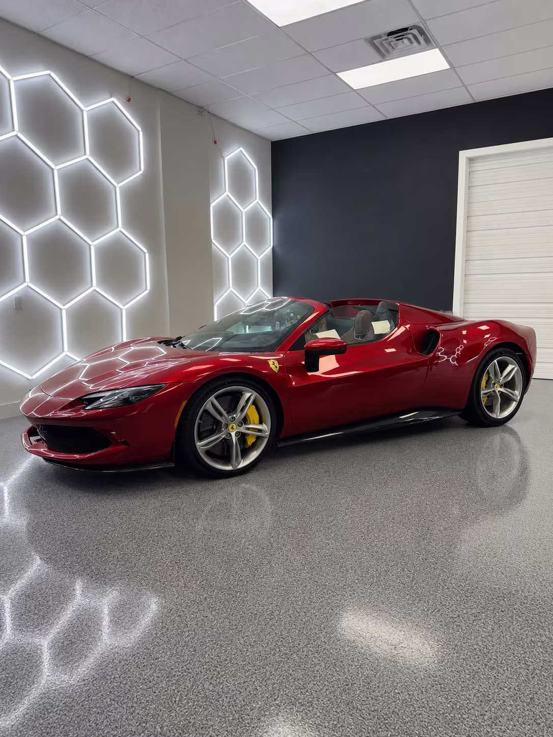 Red Ferrari spider in the bay